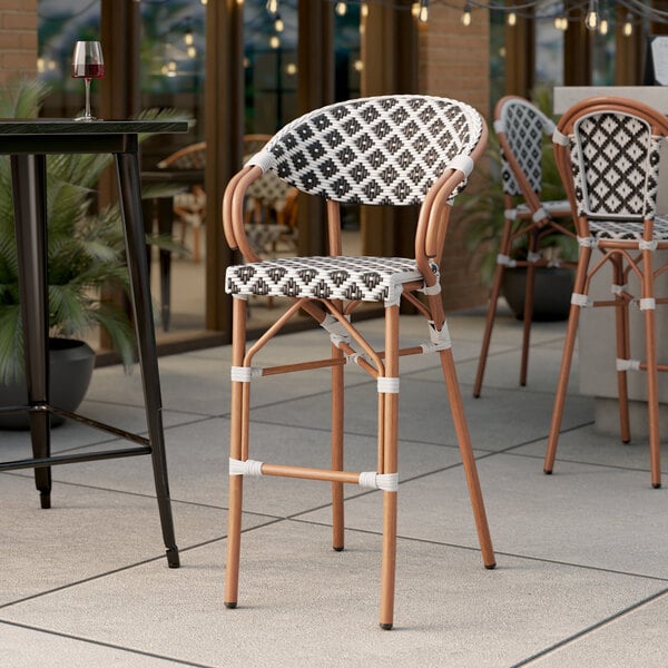 Lancaster Table & Seating Black and White Birdseye Weave Rattan Outdoor Arm Barstool