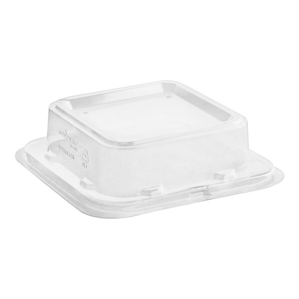 A white plastic container with a clear lid.