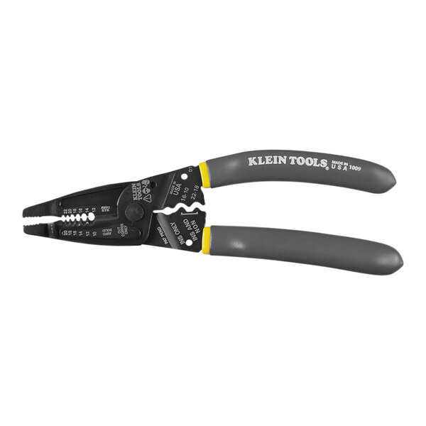 A close up of a Klein Tools wire stripper with yellow handles.