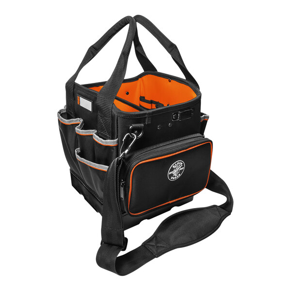 A black and orange Klein Tools tool bag with a handle.