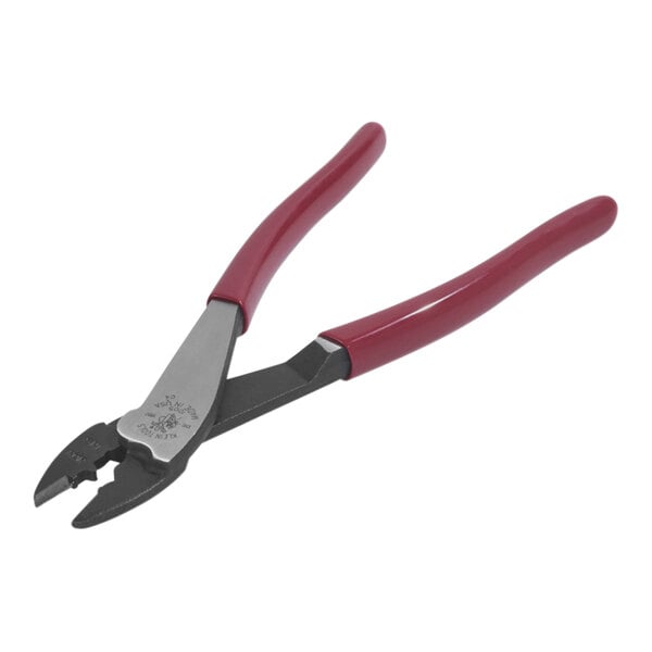 Klein Tools Crimping and Cutting Tool for Insulated / Non-Insulated Terminals and Connectors with red handles.