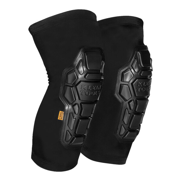A pair of black Klein Tools knee pad sleeves with a protective design.