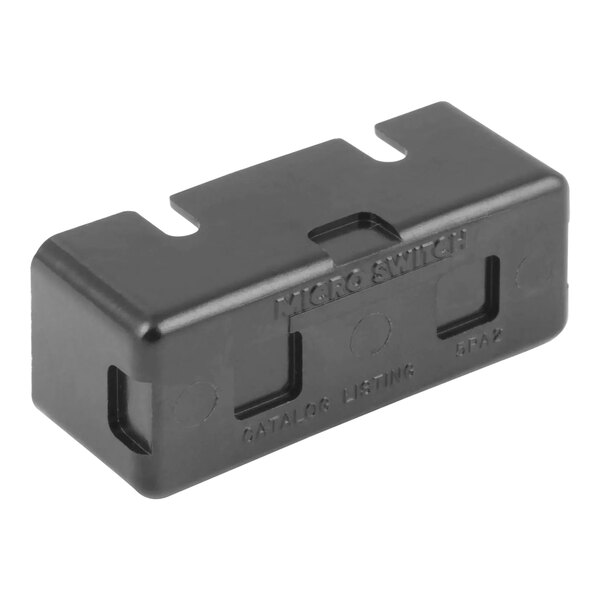 A black rectangular AccuTemp microswitch cover with text and holes.