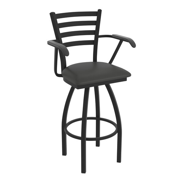 A black Holland Bar Stool Jackie Ladderback swivel bar stool with arms and a black cushion.