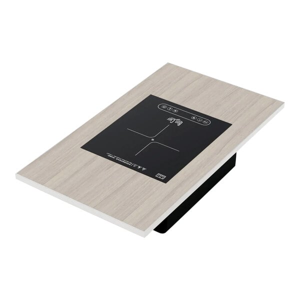 A rectangular oak and silver Bon Chef induction range with a black square on it.