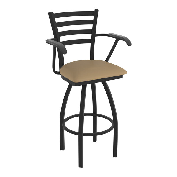 A black Holland Bar Stool with arms and a tan vinyl seat.