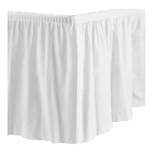 A white shirred pleat table skirt on a white table.