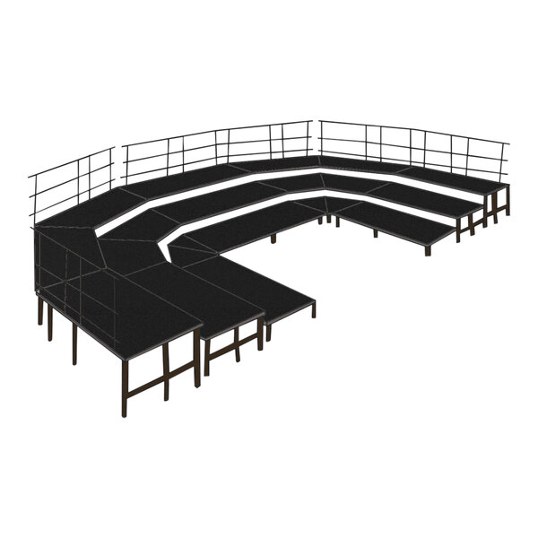 A black stage set with metal guardrails.