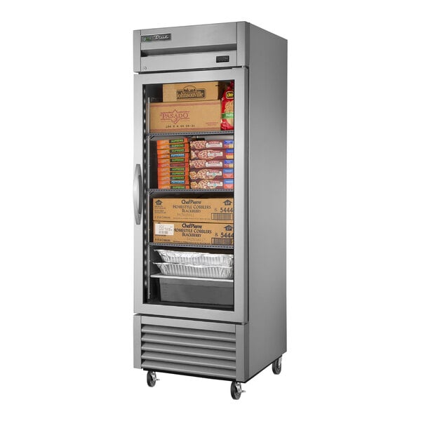 A True stainless steel reach-in freezer with glass doors.