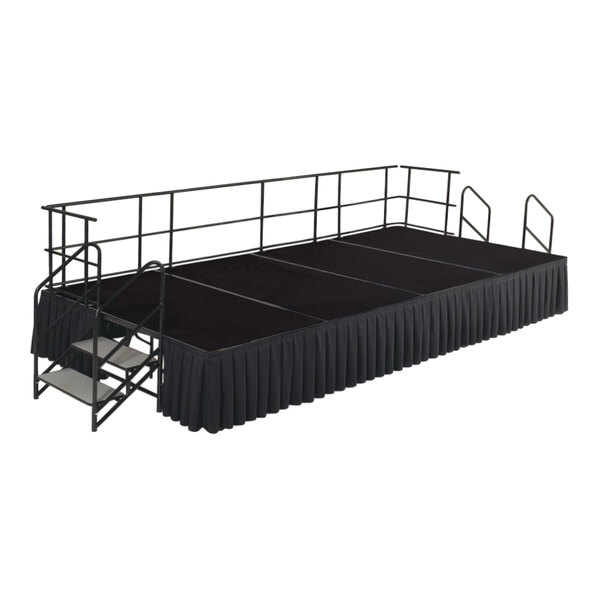 A National Public Seating black stage with black skirting and guardrails.