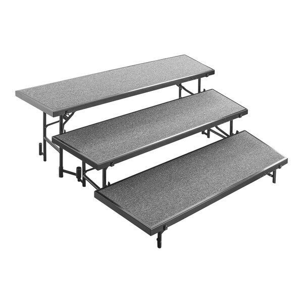 A grey rectangular table with three black metal steps.