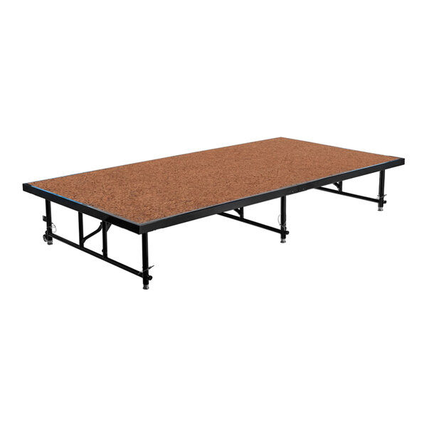 A brown hardboard National Public Seating stage platform with metal legs.