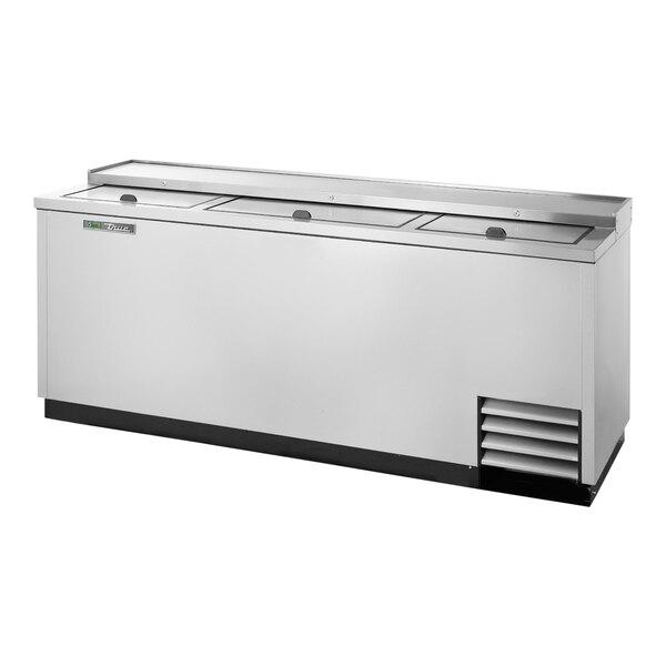A True stainless steel horizontal bottle cooler on a counter.