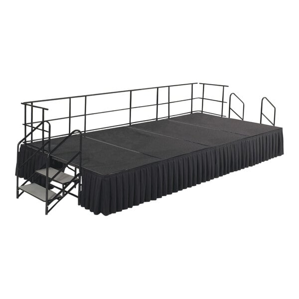 A black stage with black railings and black cloth.