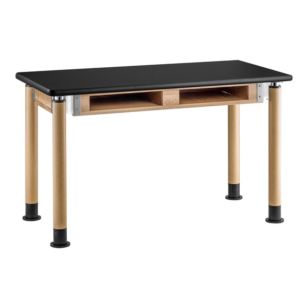 A black science lab table with oak legs.