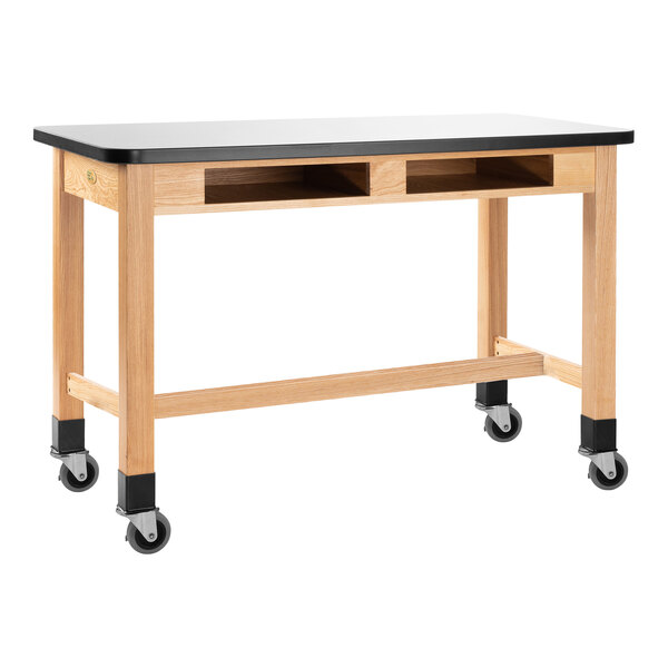 A National Public Seating wood science lab table with casters and a whiteboard top.