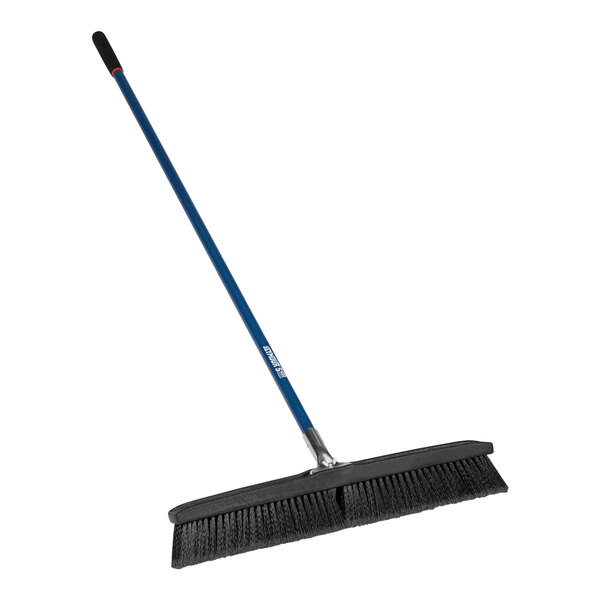 A Seymour Jobsite smooth surface push broom with a long fiberglass handle.