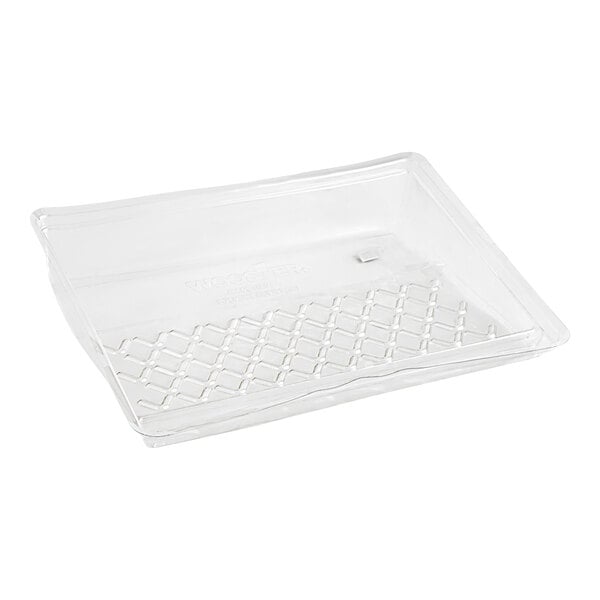 A clear plastic tray with a grid pattern.