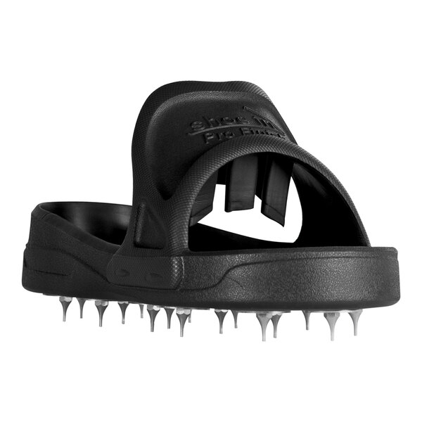 A black shoe with spikes on the bottom.