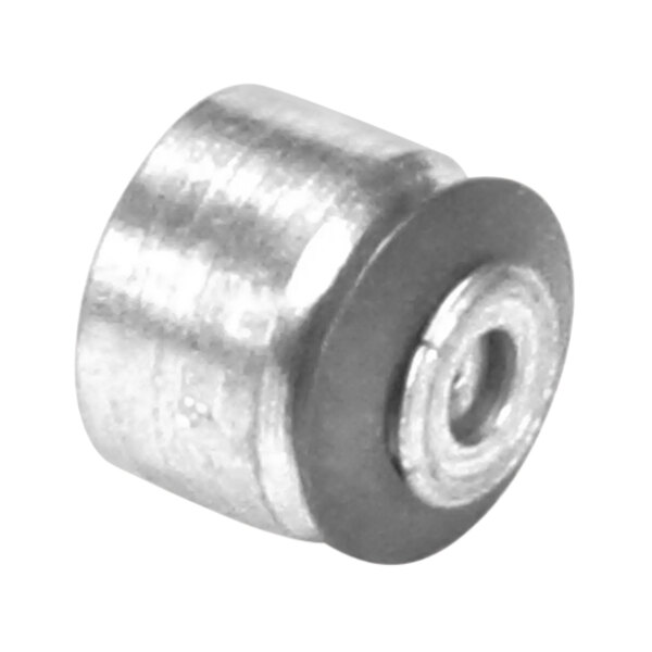 A close-up of a metal nut with a round metal cap.