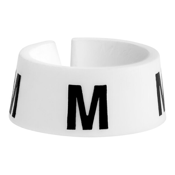 A white ring with a black letter M on it.