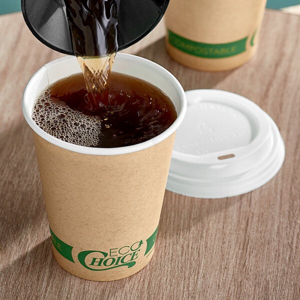 A person pouring brown coffee into an EcoChoice Kraft paper hot cup.