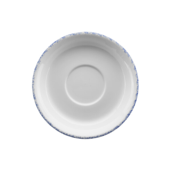 A white porcelain saucer with blue sponged accents.
