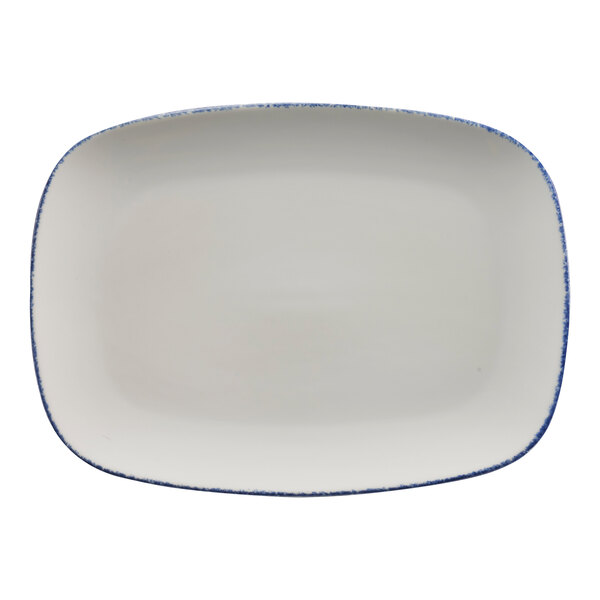 A white rectangular porcelain platter with a blue sponged rim.