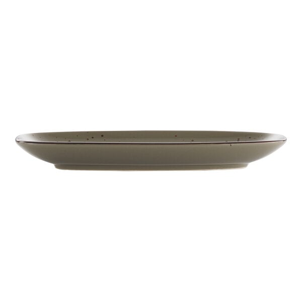 A rectangular stoneware platter with green smoke coloring on the rim.
