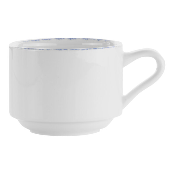 A white porcelain cup with a blue rim and handle.