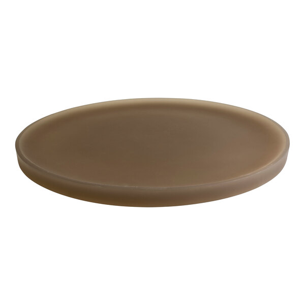 A brown circular Room360 amenity tray with a white background.