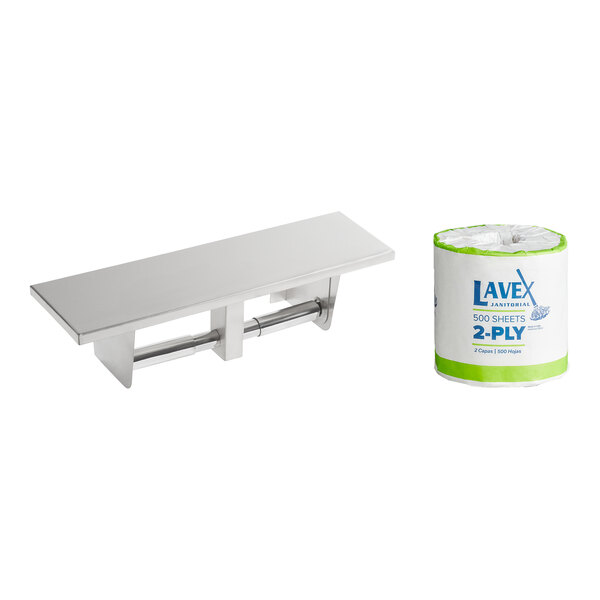 A Lavex stainless steel double roll toilet tissue dispenser on a white utility shelf next to a roll of toilet paper.