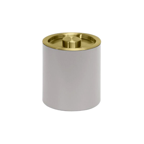 A white cylinder with a gold lid.