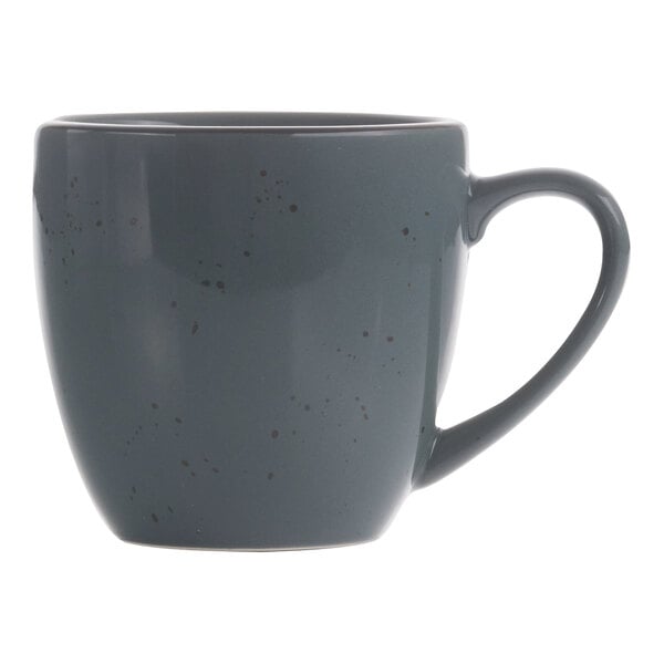 A grey stoneware cappuccino cup with a handle and speckles on it.