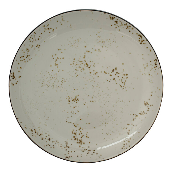 A white plate with brown speckled spots.