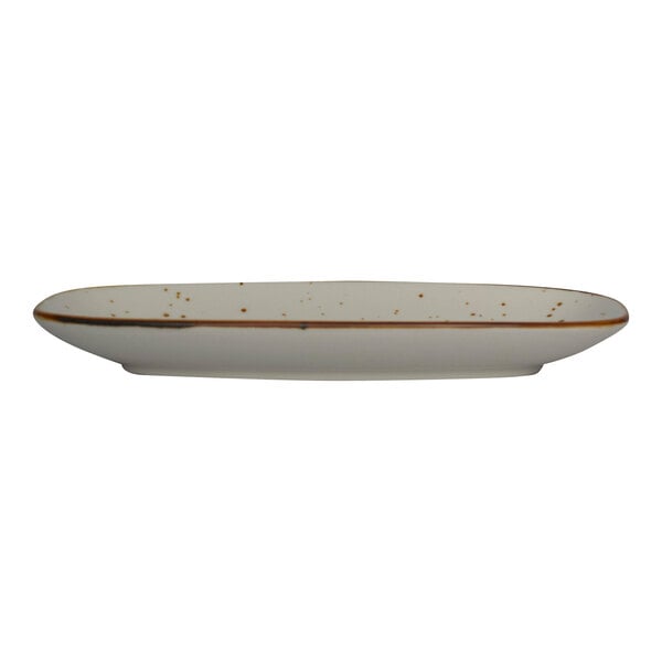 A white rectangular stoneware platter with brown speckled spots.