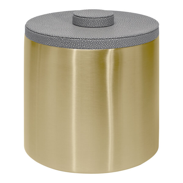 A round gold metal container with a grey lid.