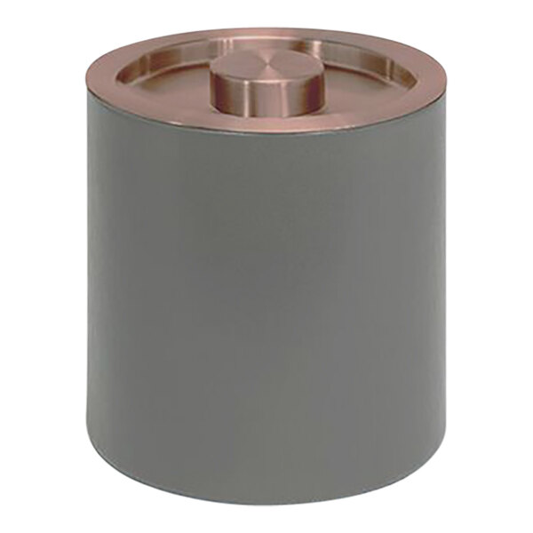 A round grey metal ice bucket with a rose gold lid.
