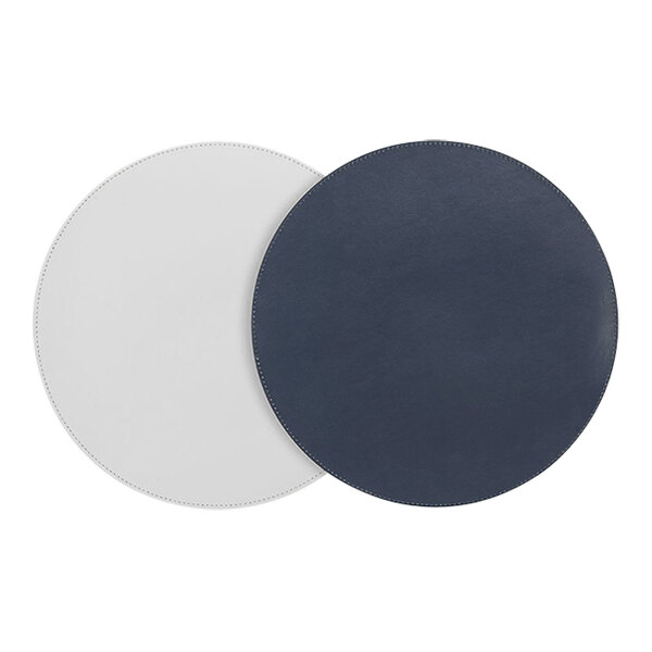 Two round white and blue Room360 London faux leather placemats.