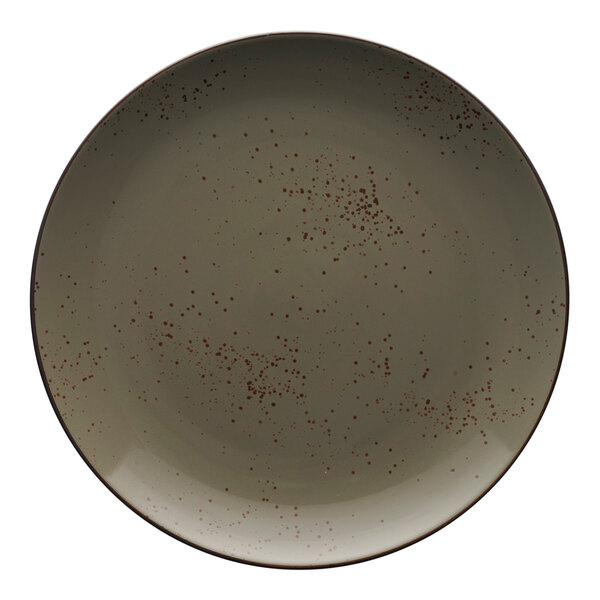 A close up of a green smoke stoneware coupe plate with a speckled pattern in brown.
