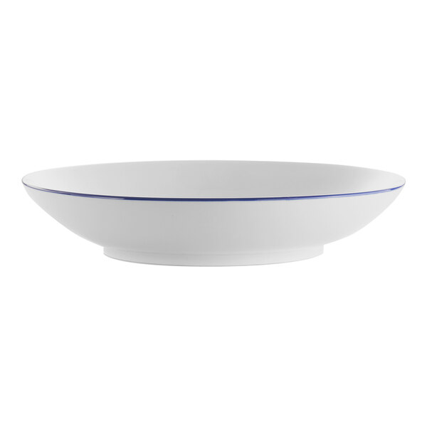 A white porcelain serving bowl with a blue rim.