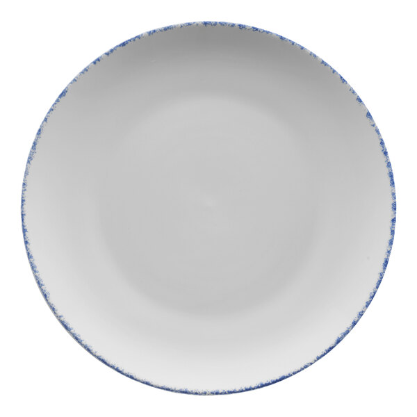 A white porcelain coupe plate with blue sponged rim.