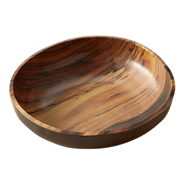 An American Metalcraft acacia wood melamine bowl with a black and brown design on a table.