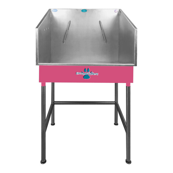 A silver stainless steel Groomer's Best mini dog bathing tub with pink accents.