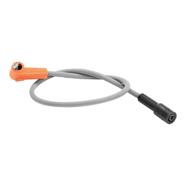 An AccuTemp ignition cable with an orange and black connector.
