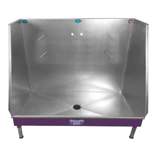 A purple metal Groomer's Best walk-in bathing tub with a center drain.