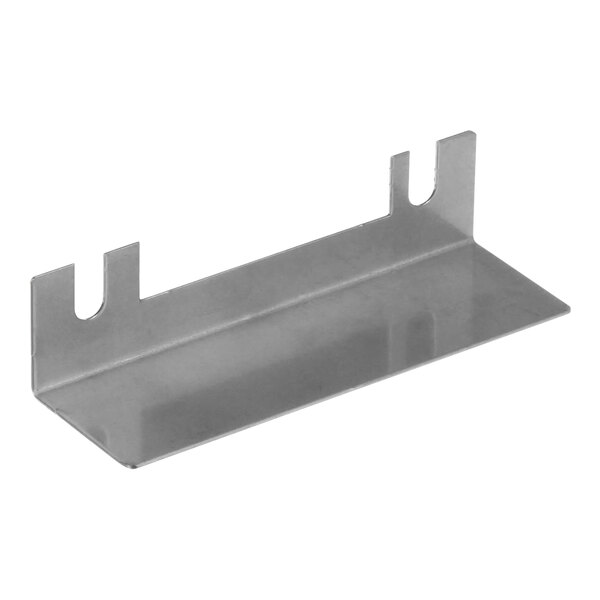 A metal shelf with two holes on it.