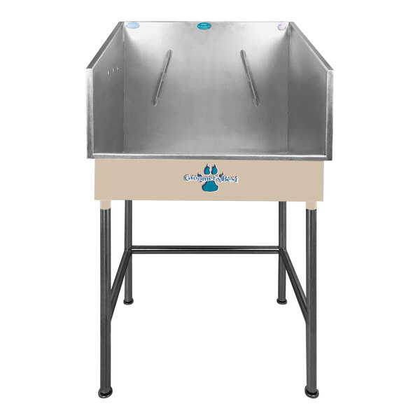 A stainless steel Groomer's Best dog bathing tub with a center drain and a blue lid.
