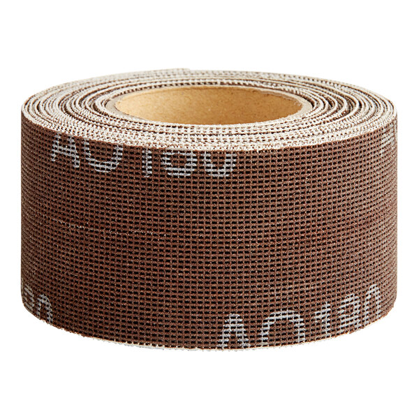 A roll of brown and white tape with white writing on it.