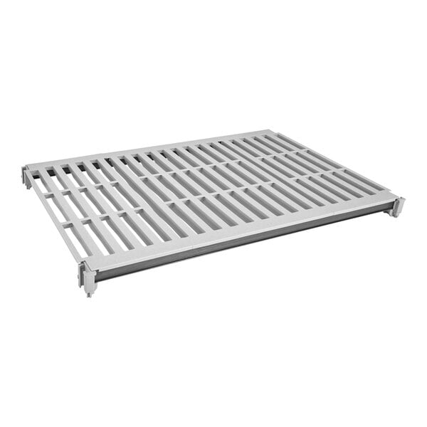 A white metal shelf with a white metal grate with holes.